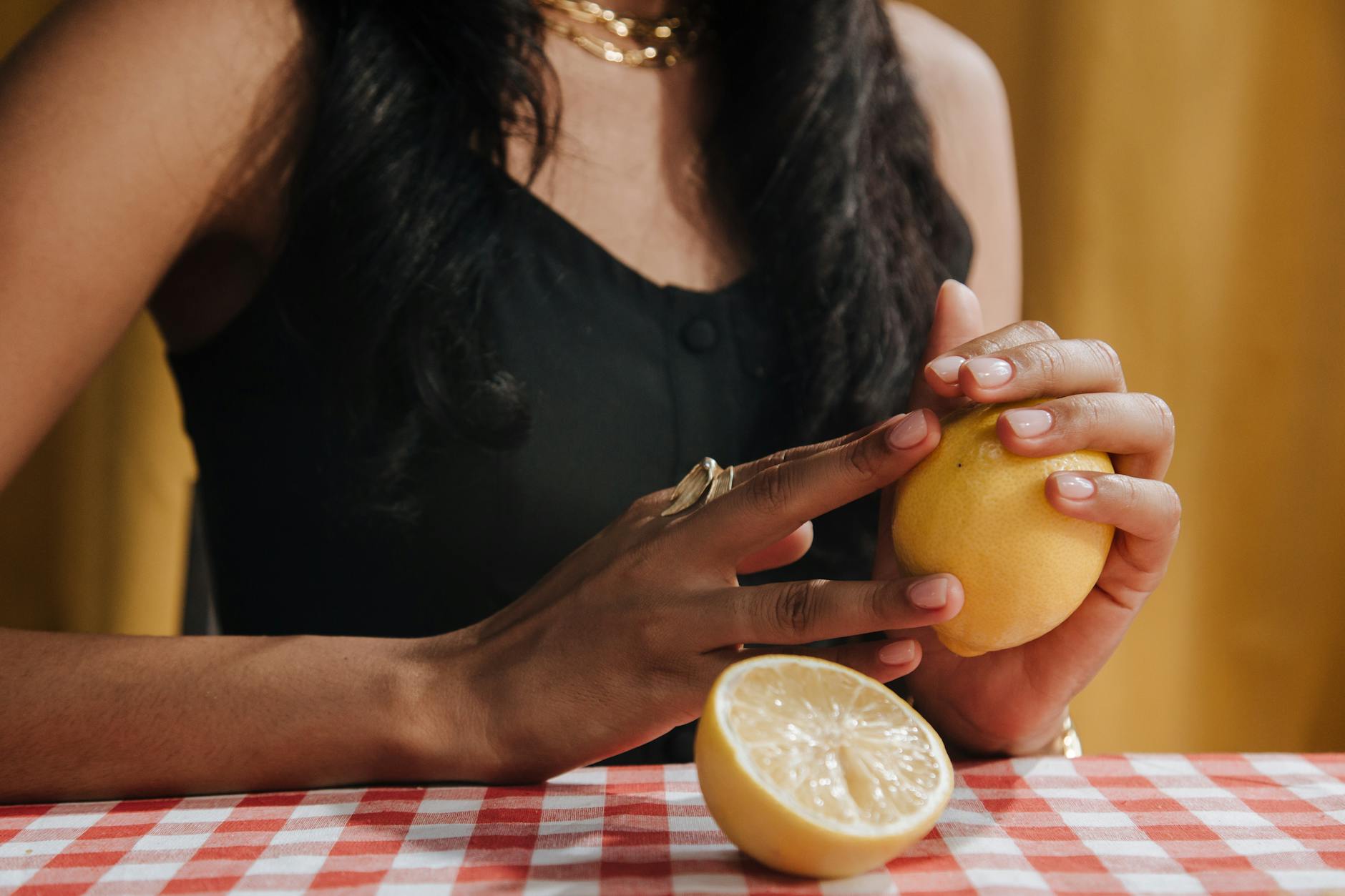 Woman holding a fresh lemon, contemplating sensory shifts and stimulant effects