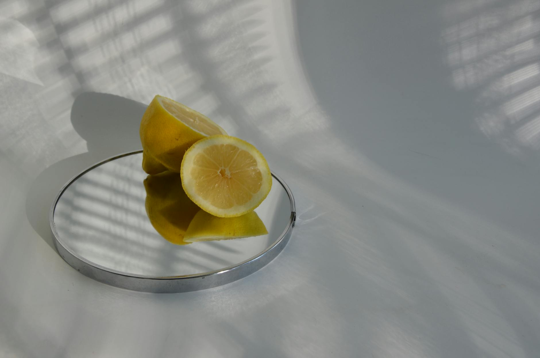 A hand holding an orange vibrator against a minimalistic purple backdrop, showcasing modern sensuality