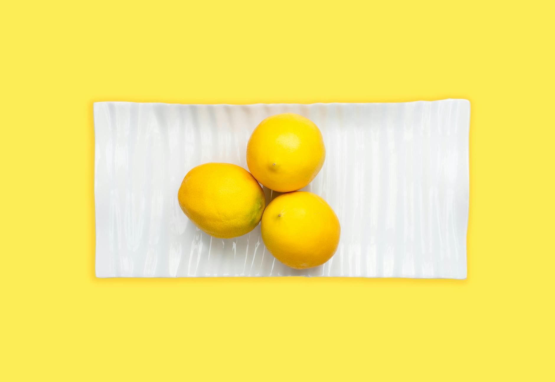 Vibrant arrangement of colorful objects on a bright yellow background, symbolizing renewed pleasure and sensitivity.