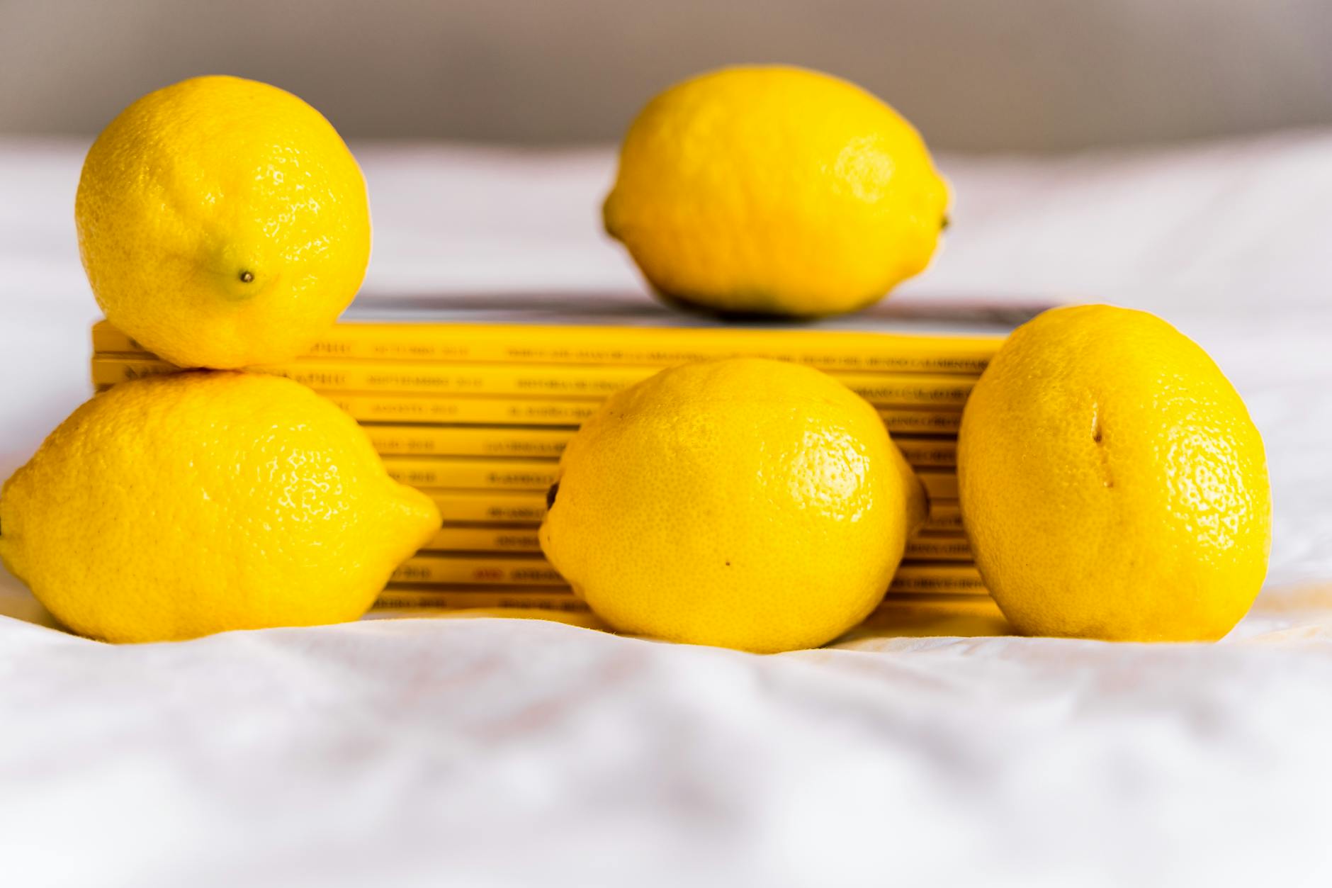 Studio arrangement of colorful clitoral vibrators on a bright yellow background
